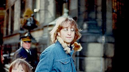 John Lennon in New York in 1977. At the left of the image are Yoko Ono and the couple's son, Sean.