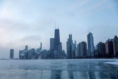 Mist rises from Chicago and Lake Michigan at sunrise on December 23, 2022, where temperatures reached -6F (-21C), ahead of the Christmas Holiday.