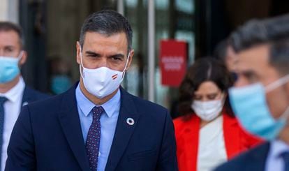 Spanish Prime Minister Pedro Sánchez  walking out of a meeting at Madrid regional headquarters.