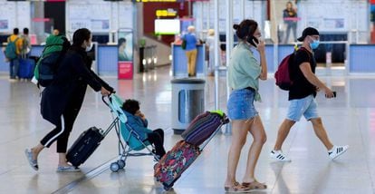 Travelers at Málaga airport in Spain.