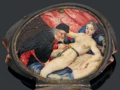 Detail of an ornament that opens to reveal a small painting of a man unlocking a woman’s chastity belt, on display at the Science & Society Picture Library, in London.