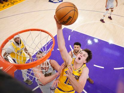 Los Angeles Lakers guard Austin Reaves, front right, drives to the basket against the Denver Nuggets in the first half of Game 4 of the NBA basketball Western Conference Final series May 22, 2023, in Los Angeles.