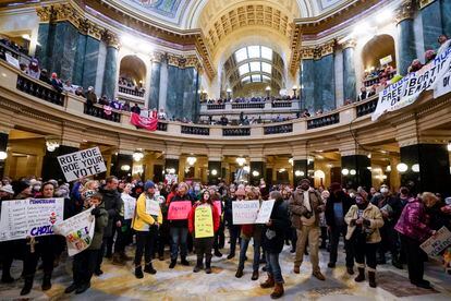 Protesters are seen in the Wisconsin Capitol Rotunda during a march supporting overturning Wisconsin's near total ban on abortion, on Jan. 22, 2023, in Madison, Wis.