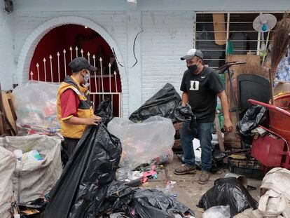 Recyclers separate plastic at a building in the Iztapalapa mayor's office in Mexico City, Aug. 10, 2020.