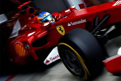 Fernando Alonso eases his Ferrari into action during the first practice session in Hungary.