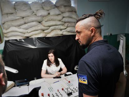 Oleksandr Kamishin listens to rail employees at a station in the Lviv region, in the west of the country.