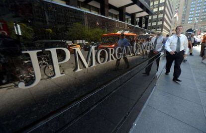 This file photo taken on August 14, 2013 shows people walking by JP Morgan Chase &amp; Company headquarters in New York. 