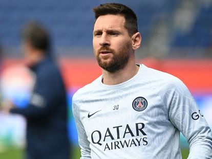 Paris Saint-Germain's Argentine forward Lionel Messi looks on as he warms up prior to the French L1 football match between Paris Saint-Germain (PSG) and FC Lorient at The Parc des Princes Stadium in Paris.