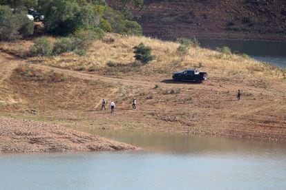 A police search team walk on the shore of the Arade dam near Silves, Portugal, on May 24, 2023.