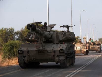 Israeli armored artillery vehicles heading to the border with Gaza on October 8, 2023, on a road in the city of Sderot.