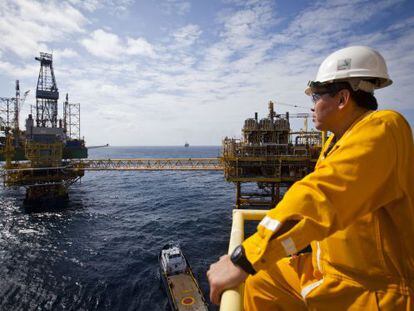 A Pemex worker observes a platform at the Ku-Maloob-Zaap offshore field in Mexico.