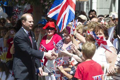 Britain&#039;s Prince Edward, Earl of Wessex (L) greets people as he arrives in Gibraltar June 11.
