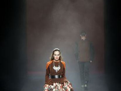 A model showcases designs by Ana Locking on the runway at the Mercedes-Benz Fashion Week in Madrid. 