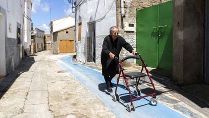 Rosa, 86, walks along a special anti-slip path in Pescueza.