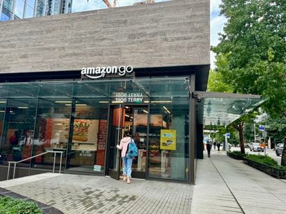 A girl walks into an Amazon Go supermarket in Seattle.