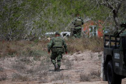 Mexican soldiers at the site where the four Americans were found, on March 7.