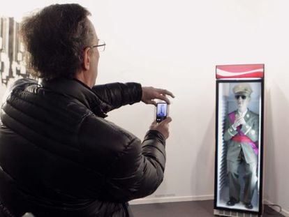 The vicepresident of the Francisco Franco Foundation, Jaime Alonso, takes photos of the offending work at ARCO.