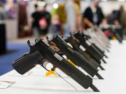 FILE - An array of pistols are shown in the Dan Wesson display as guests browse firearms at the National Rifle Association's Annual Meetings & Exhibits in Indianapolis, April 16, 2023. The roster of Republican presidential hopefuls who flocked to the National Rifle Association's annual convention reflects the political potency of gun rights, despite the group's eroding revenues and an opposition movement that's growing increasingly vocal as the drumbeat of mass shootings marches on.(AP Photo/Michael Conroy, File)
