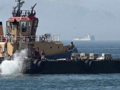A Gibraltarian tug dumps concrete slabs into the water close to the colony&#039;s airport last month.