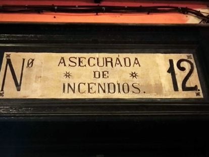A plaque on a building in Madrid says it is “insured for fire.”