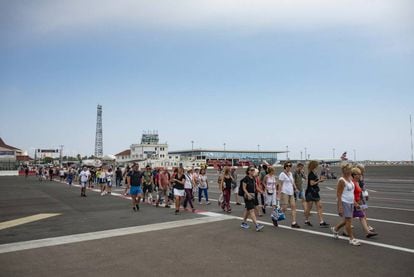 Visitors cross the airport of Gibraltar.