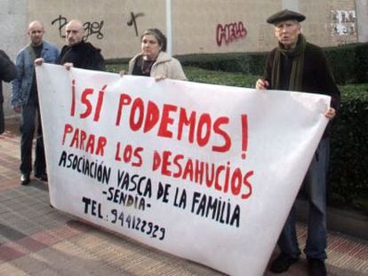 Members of the Basque Family Association hold a protest where the woman died in Barakaldo Friday.