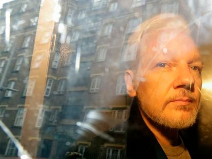 WikiLeaks founder Julian Assange is taken from court, where he appeared on charges of jumping British bail seven years ago, in London, on May 1, 2019.