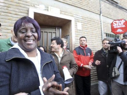 A woman bursts into tears after an eviction against her is stopped in Zaragoza Thursday. 