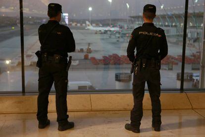 Police officers at Madrid’s Adolfo Suárez-Barajas airport.