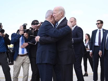 Israel Prime Minister Benjamin Netanyahu (l) hugs U.S. President Joe Biden upon his arrival at Tel Aviv's Ben Gurion airport on October 18, 2023.