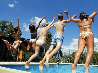 A group of children takes the plunge at a summer camp in Madrid.