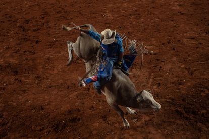 A cowboy performs a bull-riding demonstration during the rodeo. The ranchers drive the main national economic engine – agriculture – which accounts for 25% of Brazil’s GDP.
