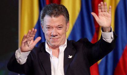 Juan Manuel Santos greets supporters after his victory on Sunday.