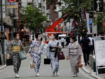 Women in Tokyo wearing facemasks in July.