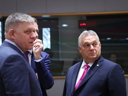 Hungarian Prime Minister Viktor Orban (R) and Slovakia's Prime Minister Robert Fico (L) during the European Council meeting in Brussels, Belgium, 26 October 2023.