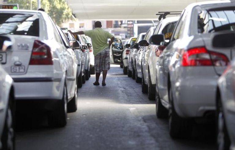 A taxi driver waits for a fare at Madrid's Atocha railway station.