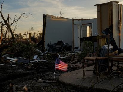 An American flag flies in front of the wreckage of a home after thunderstorms spawning high straight-line winds and tornadoes ripped across the state in Rolling Fork, Mississippi, U.S. March 27, 2023