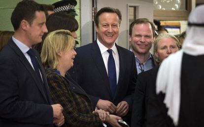PM David Cameron and party members celebrating preliminary results.