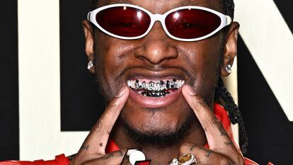 Stylist and influencer Bloody Osiris, seen wearing his grill, attends a runway show during Paris Fashion Week, on January 20.