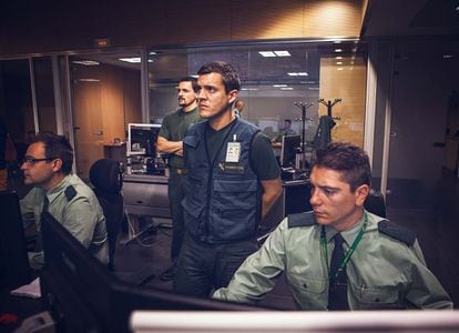 Three civil guards monitor real-time information in the Operations Room.