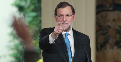 Prime Minister Mariano Rajoy takes questions from reporters on Monday.