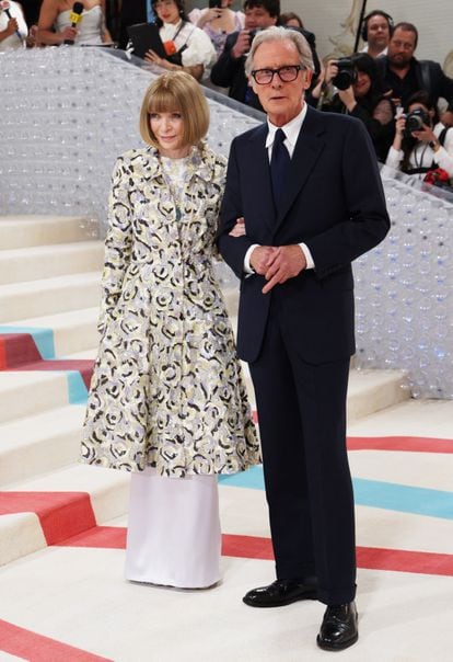 Anna Wintour, the main hostess of the gala, with her partner, actor Bill Nighy. Wintour is wearing a coat from Chanel's latest spring summer 2023 couture collection, designed by Virginie Viard.