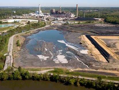 The Richmond city skyline can be seen on the horizon behind the coal ash ponds along the James River near Dominion Energy's Chesterfield Power Station in Chester, Va., Tuesday, May 1, 2018.