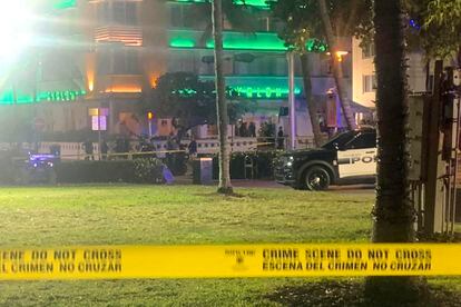 Crime scene tape is shown at the scene along Ocean Drive in Miami Beach, Fla. Friday, March 17, 2023, where police say one person was killed and a second was wounded when gunfire erupted in an area of Miami Beach crowded with people on spring break.