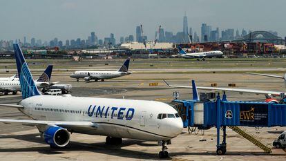 The New York skyline are seen while United Airlines planes use the tarmac at Newark Liberty International Airport in Newark, New Jersey, U.S., May 12, 2023.