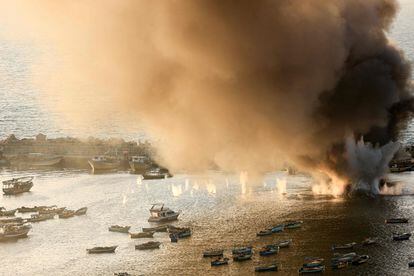  Smoke billows after a strike by Israel on the port of Gaza City on October 10, 2023. 