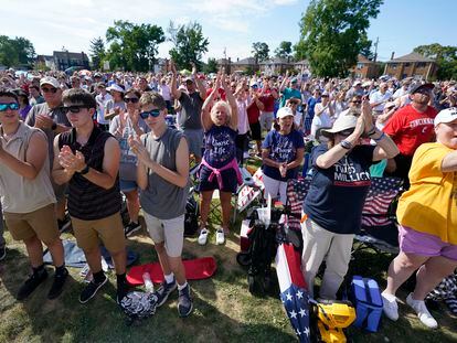 A crowd cheers as Jim Caviezel speaks during a "rosary rally" on Aug. 6, 2023, in Norwood, Ohio.