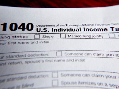 This February 13, 2019 file photo shows part of a 1040 federal tax form printed from the Internal Revenue Service website.