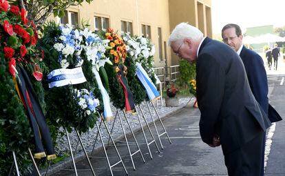German President Frank-Walter Steinmeier bows at the wreath to the victims of the 1972 Munich massacre in front of Israeli President Isaac Herzog.