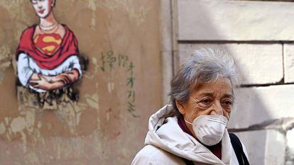 A woman wears a face mask in Rome during the coronavirus crisis.